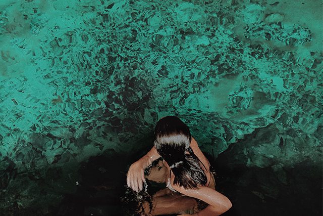 swim in emerald waters